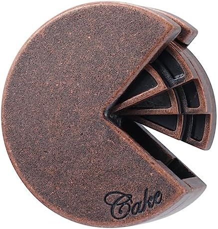 Cake hanayama cast metal puzzle assembled on a work bench