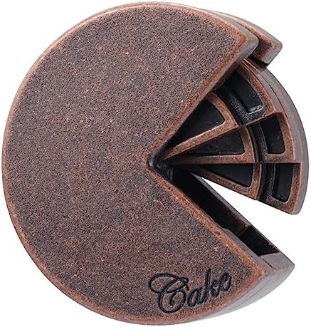 Cake hanayama cast metal puzzle assembled on a work bench