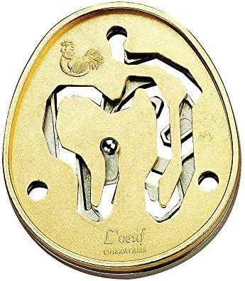 Golden Color hanayama cast metal puzzle assembled on a work bench
