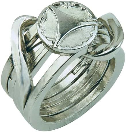 Ring hanayama cast metal puzzle assembled on a work bench